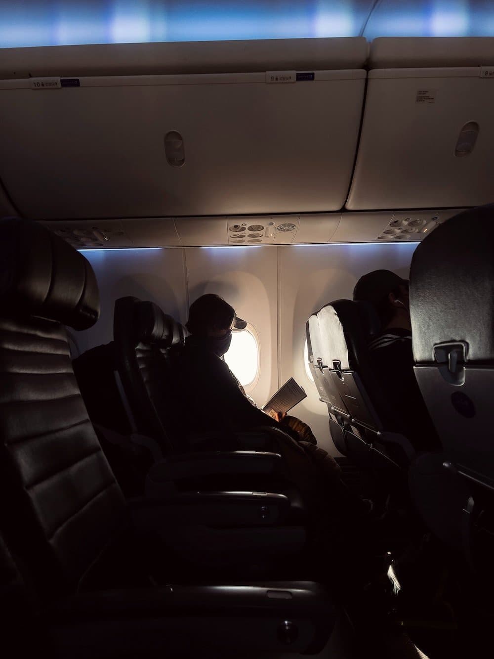 Man looking out plane window